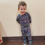 young boy wearing christmas pajamas