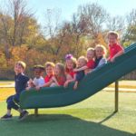 kids on slide at playground