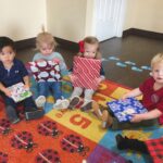 kids opening presents in classroom