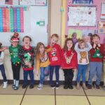 kids wearing christmas sweaters at school