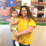 teacher holding student