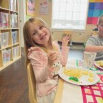 young girl eating lunch