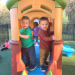two boys on playset