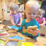 child playing with puzzle