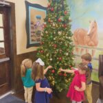 kids decorating christmas tree