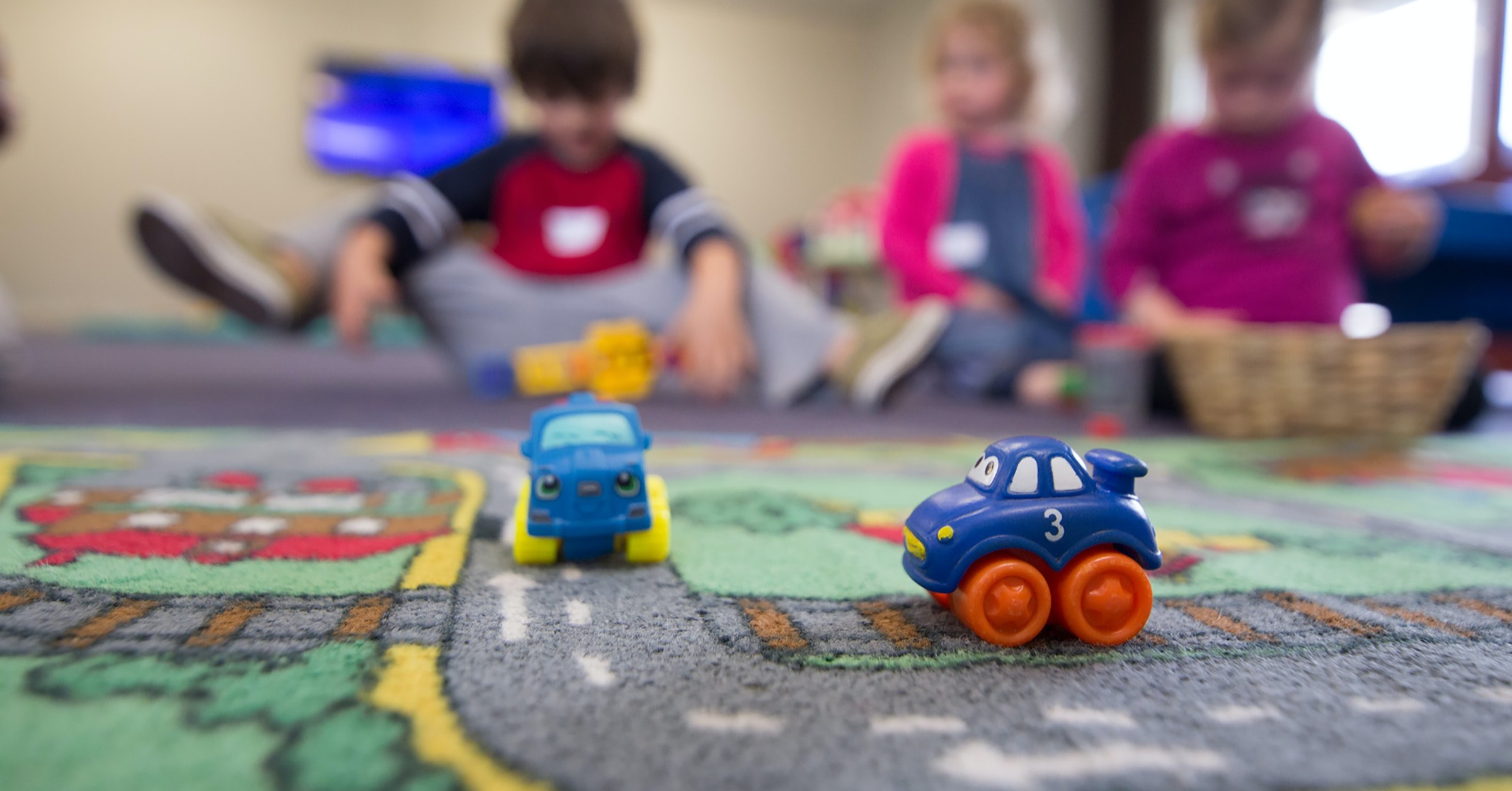 kids playing with toys on carpet
