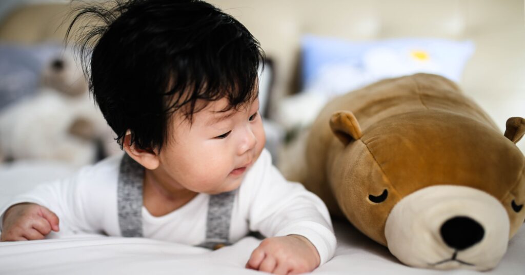baby with stuffed animal