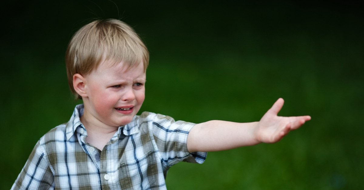 crying child with hand out