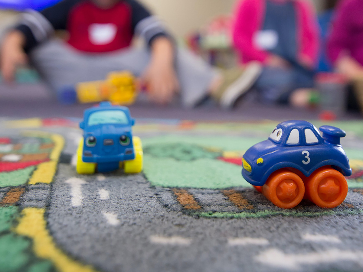 children playing with toy cars