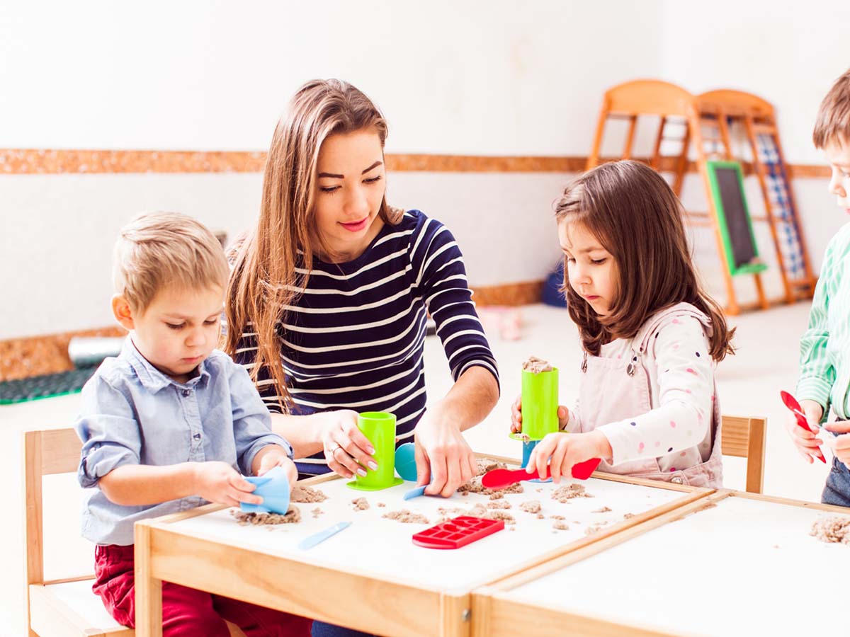 kids working on art with teacher