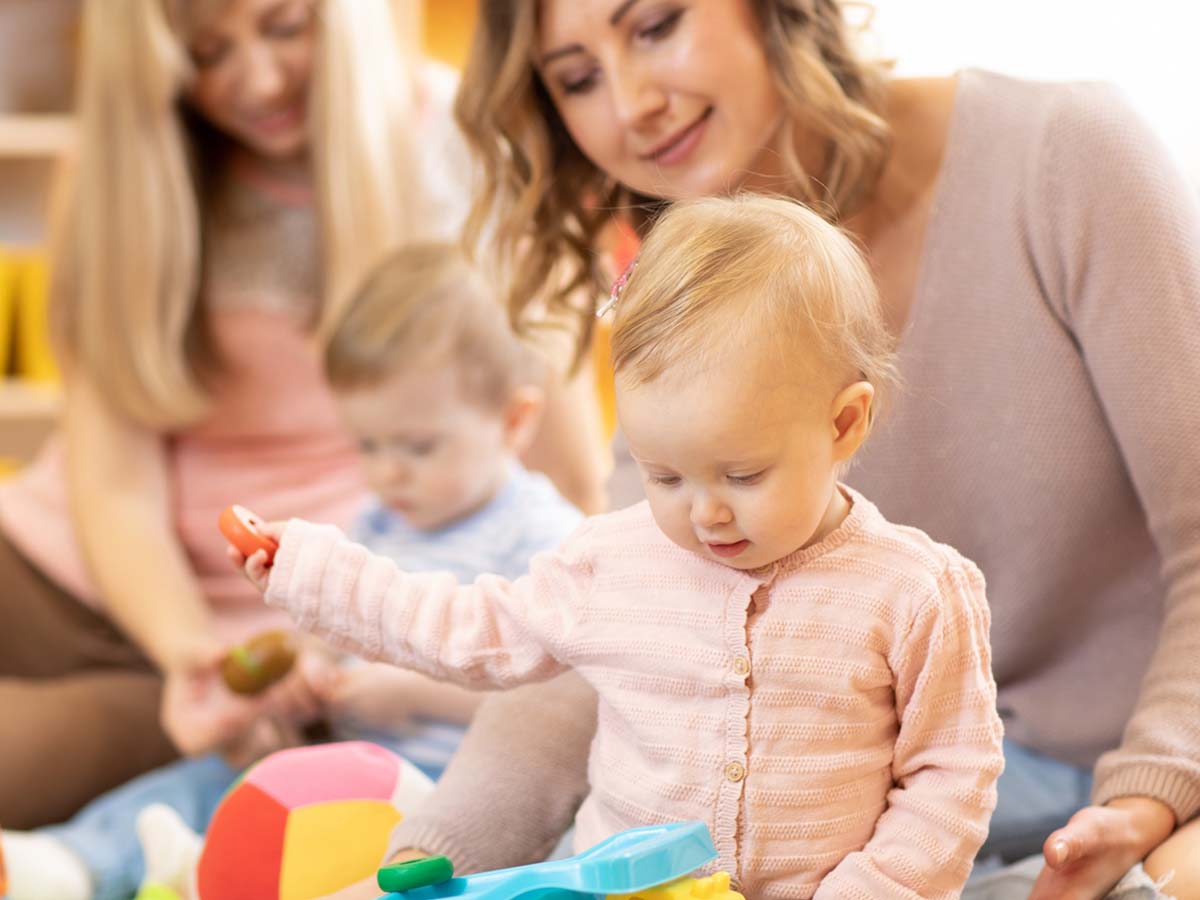 baby playing with toys on the floor