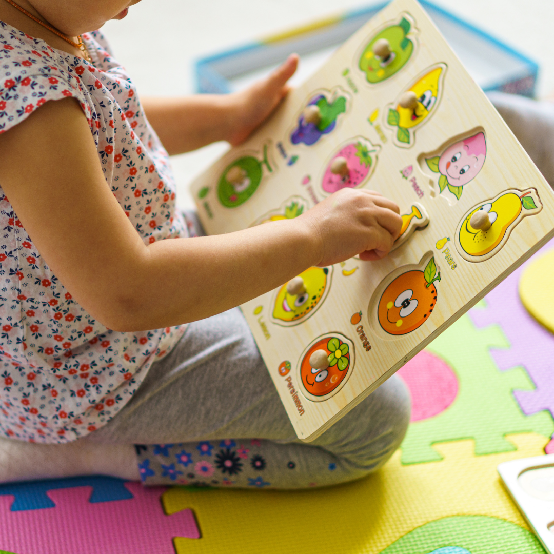 girl playing with puzzle