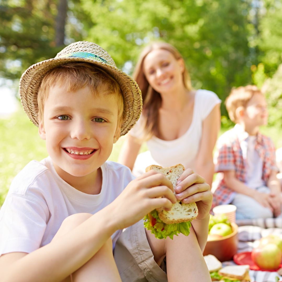 child at picnic with family