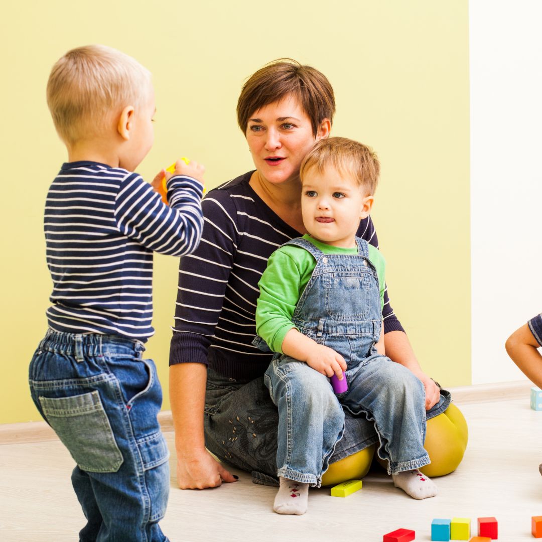 children and woman at daycare