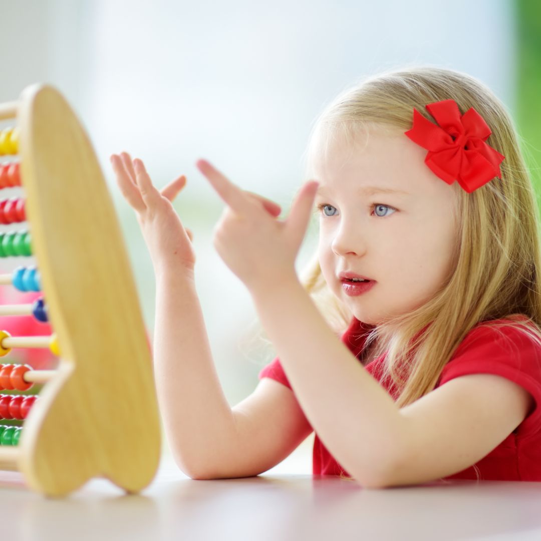 a little girl trying to count