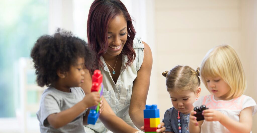 teacher working with students