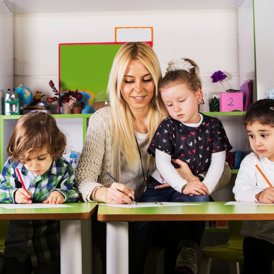 teacher working with students