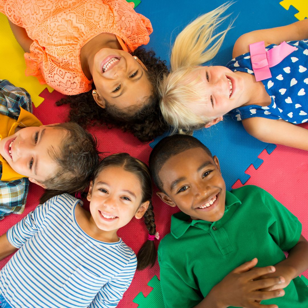 kids laying on floor together