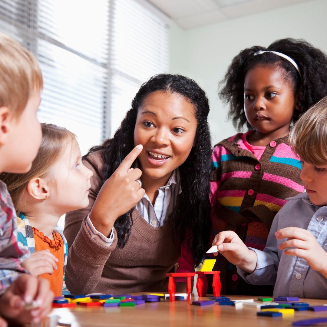 teacher talking with students
