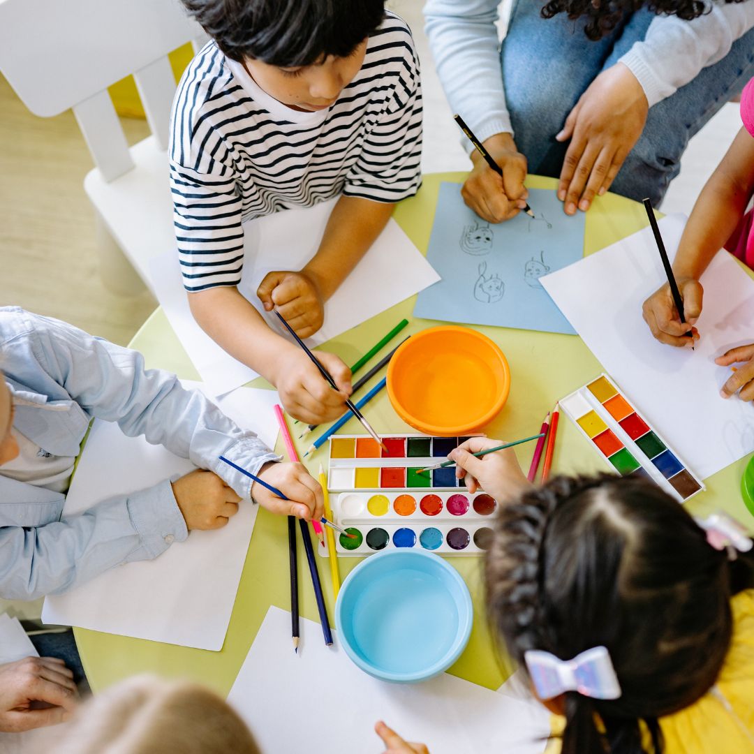 kids painting in classroom