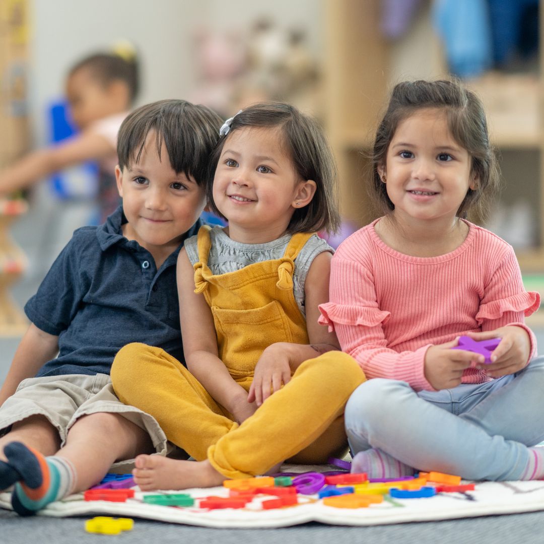 children sitting and listening