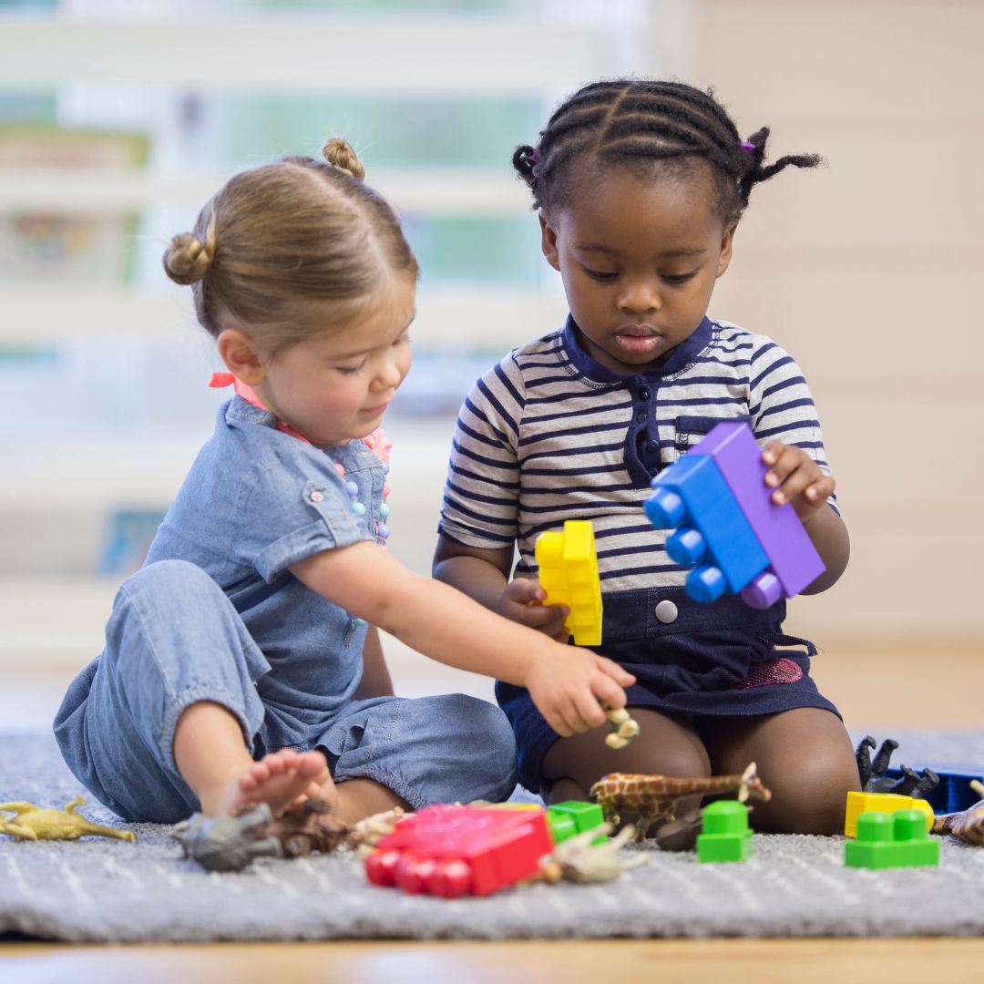 children playing with building toys