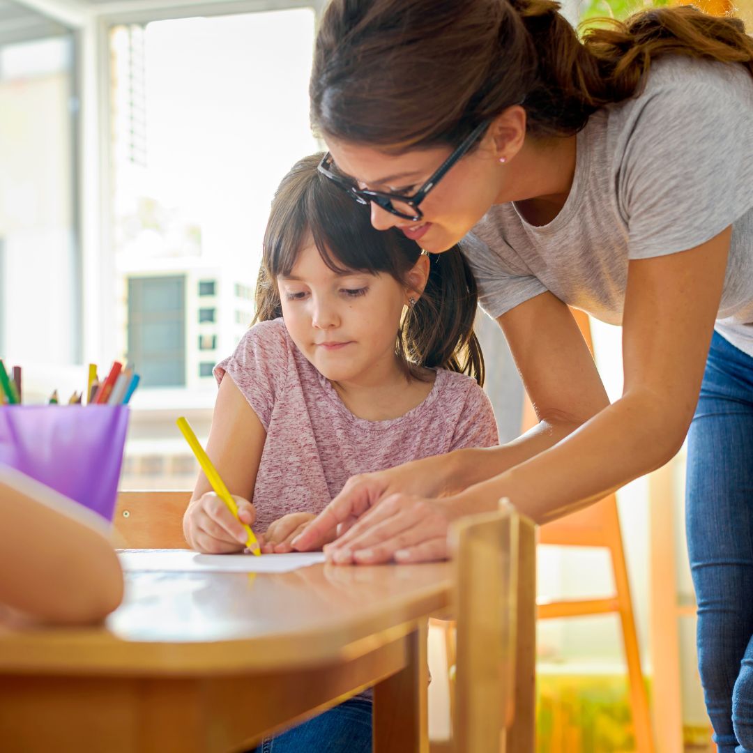 instructor helping student write