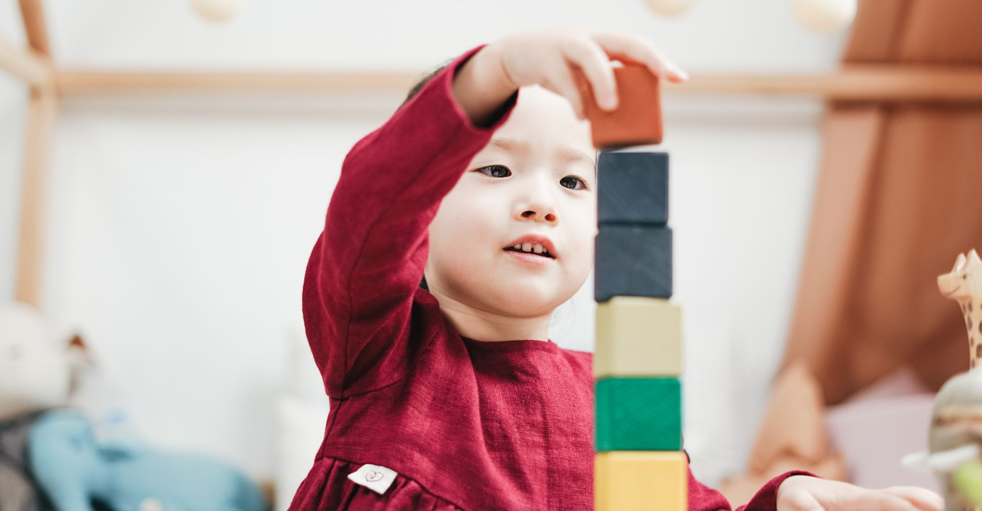 A girl playing with blocks