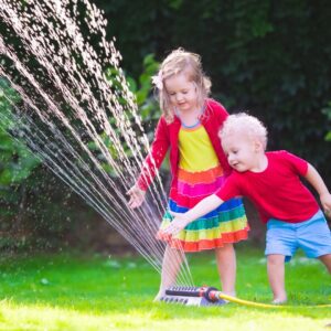 Kids playing with a sprinkler