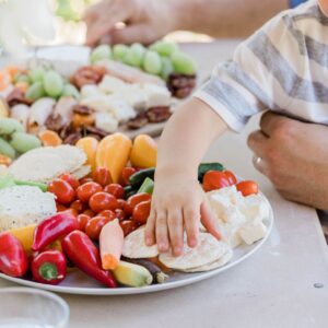 Young kid eating off a platter