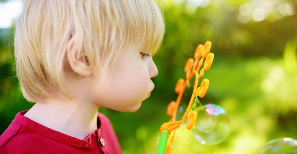 Boy blowing bubbles