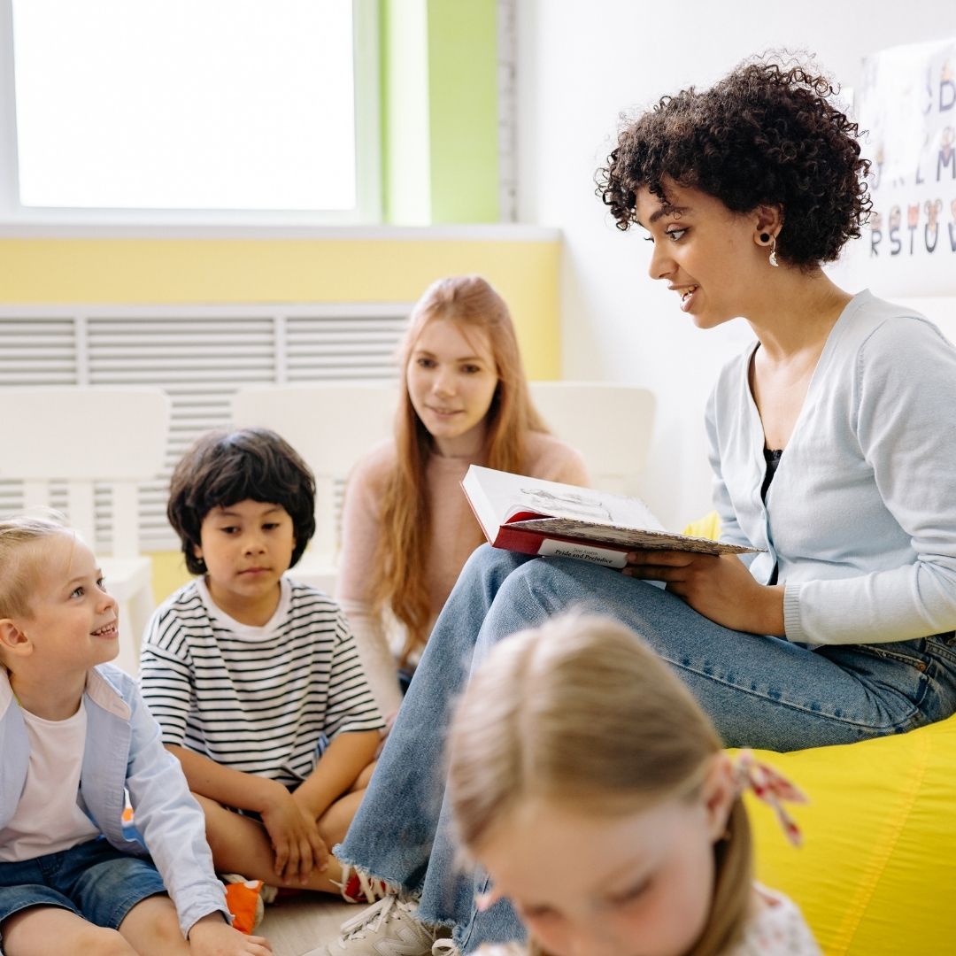 teacher reading to young children