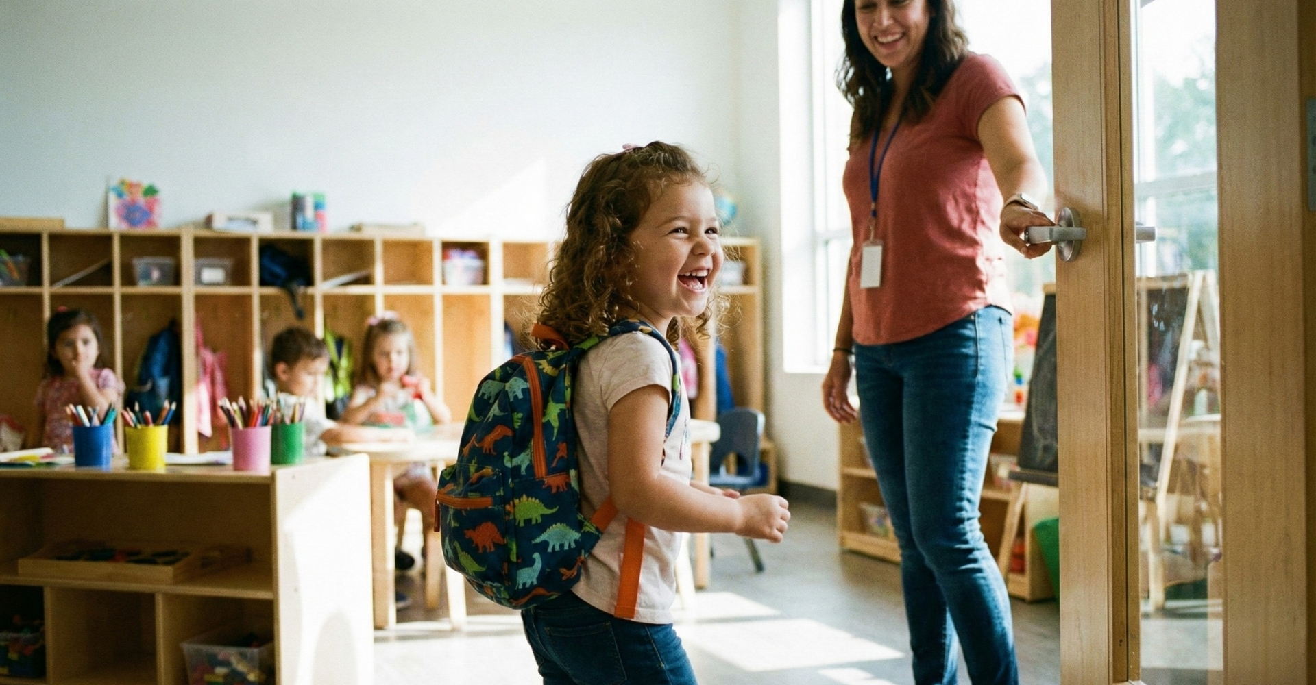 a happy preschooler with a small backpack walking into class