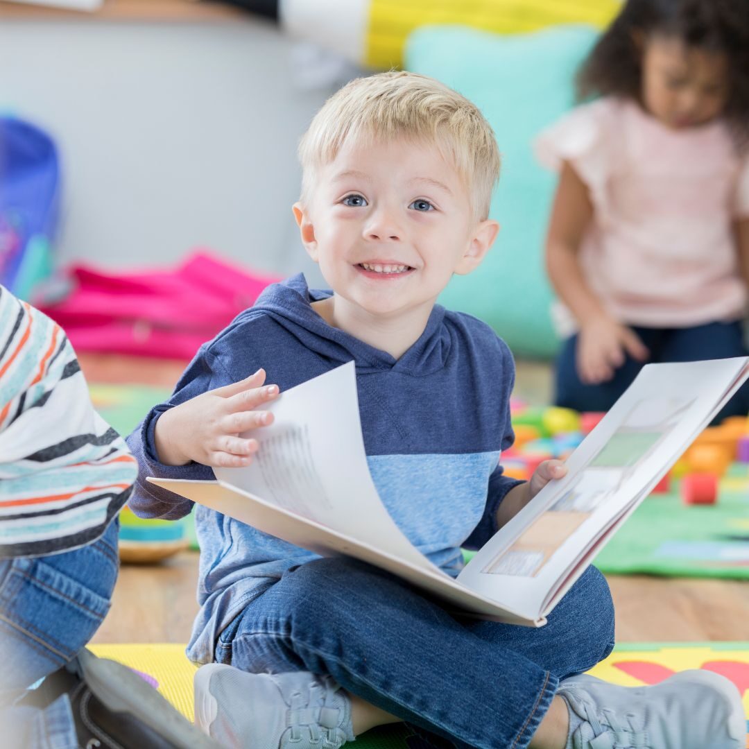preschooler excitedly turning pages of book