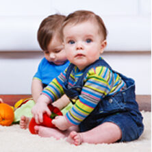 baby playing on rug